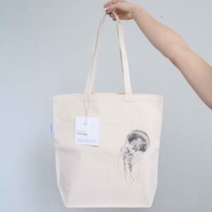 Jellyfish tote bag featuring an ink sketch by Kelowna based artist Jennifer Delaney. Handmade, minimalistic, and ethical.