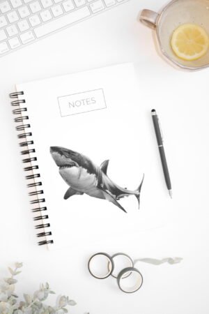 Minimalistic shark notebook. Hardcover. Featuring art by Okanagan artist Jennifer Delaney. Pen and marker ink sketch. Based in Kelowna, BC.