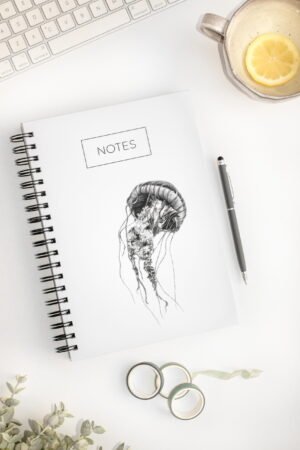 Minimalistic jellyfish notebook. Hardcover. Featuring art by Okanagan artist Jennifer Delaney. Pen and marker ink sketch. Based in Kelowna, BC.