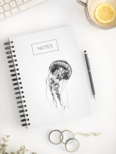 Minimalistic jellyfish notebook. Hardcover. Featuring art by Okanagan artist Jennifer Delaney. Pen and marker ink sketch. Based in Kelowna, BC.