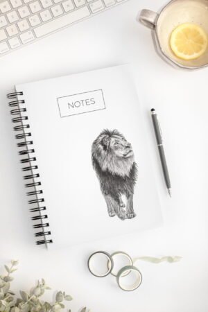 Minimalistic lion notebook. Hardcover. Featuring art by Okanagan artist Jennifer Delaney. Pen and marker ink sketch. Based in Kelowna, BC.