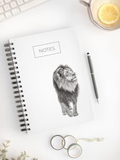 Minimalistic lion notebook. Hardcover. Featuring art by Okanagan artist Jennifer Delaney. Pen and marker ink sketch. Based in Kelowna, BC.